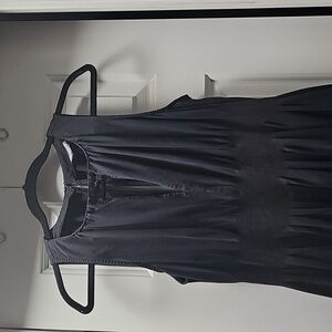 Black Sleeveless Dress With Tight Waistline And Pockets